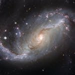 Capture of the NGC 1672 spiral galaxy showcasing its majestic spiral arms and bright core.